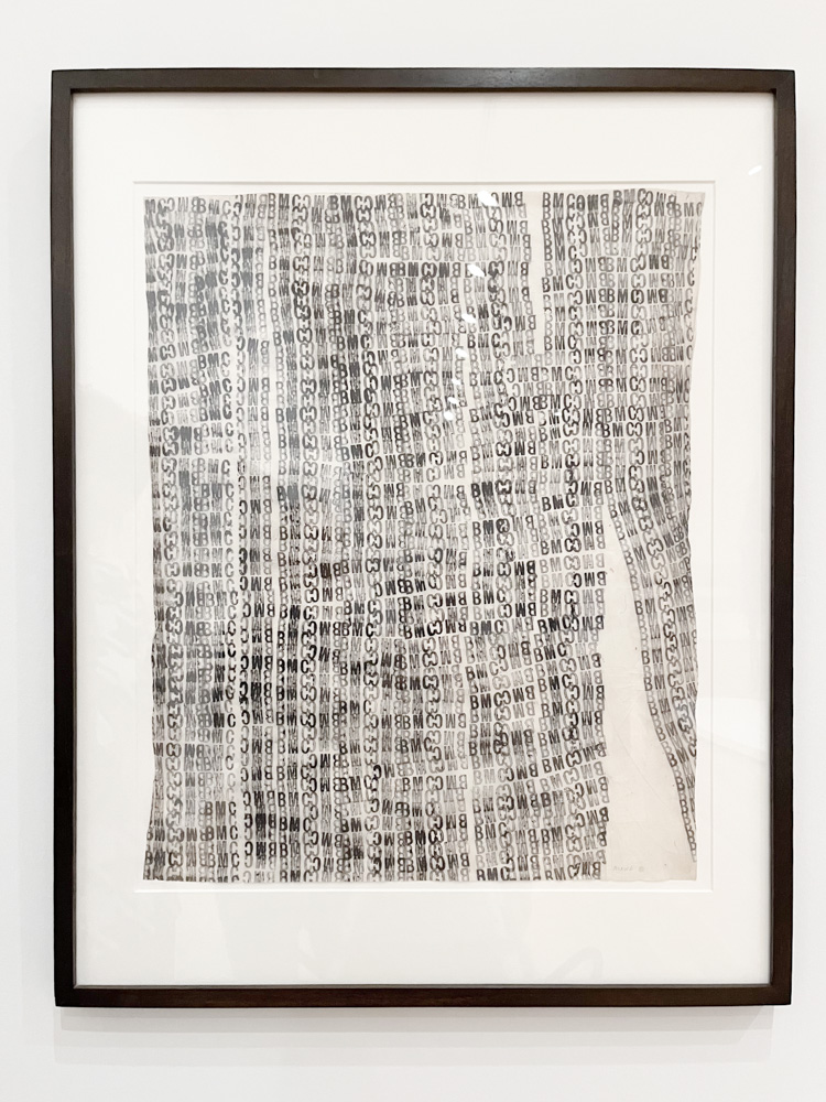 A sheet filled with an organic grid of laundry stamps in black ink.